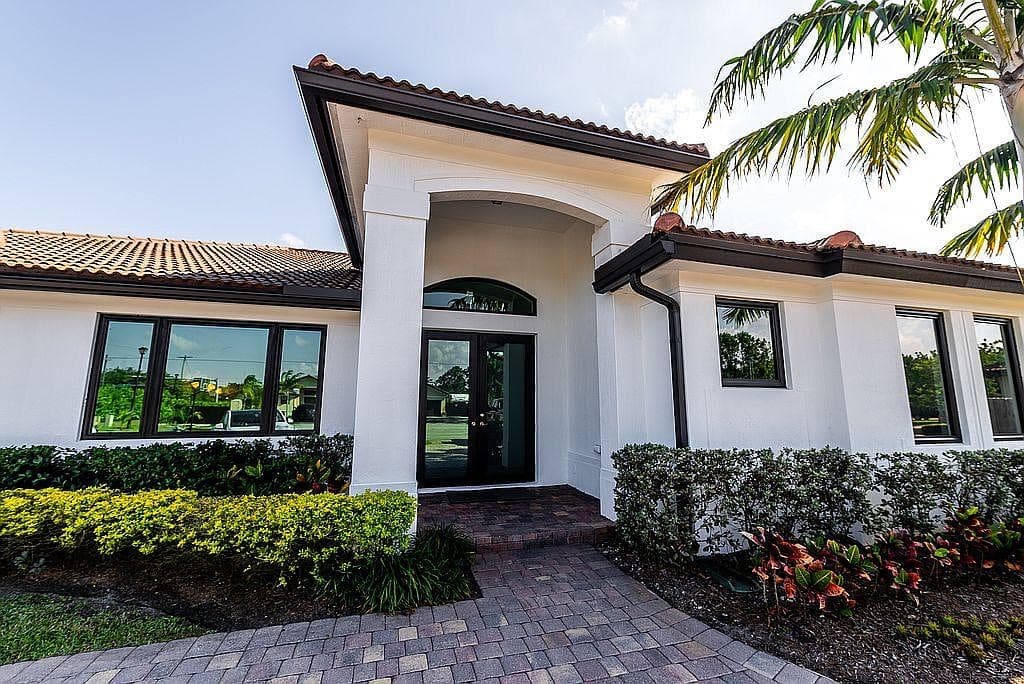 South Florida home exterior with clean painted finish